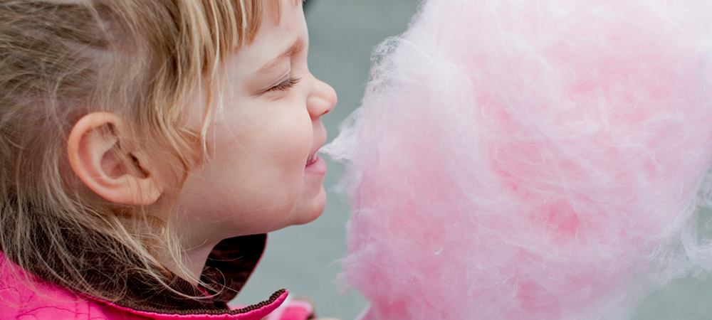 Girl eating cotton candy