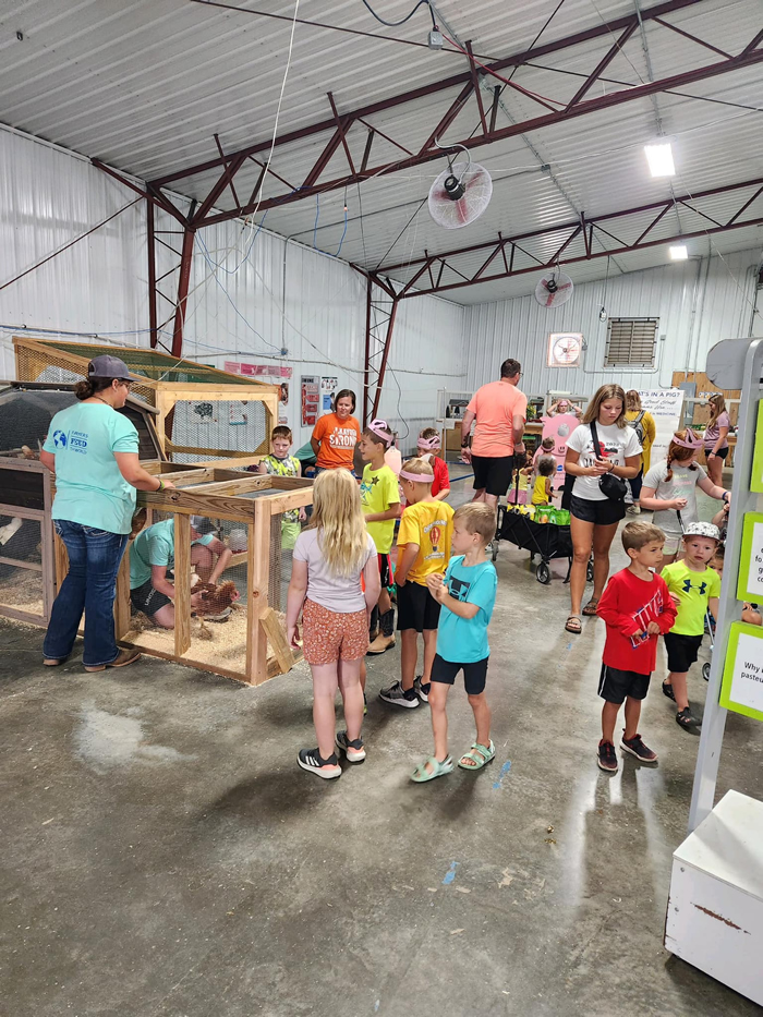 Kids going through Ralco Building at Lyon County Fair